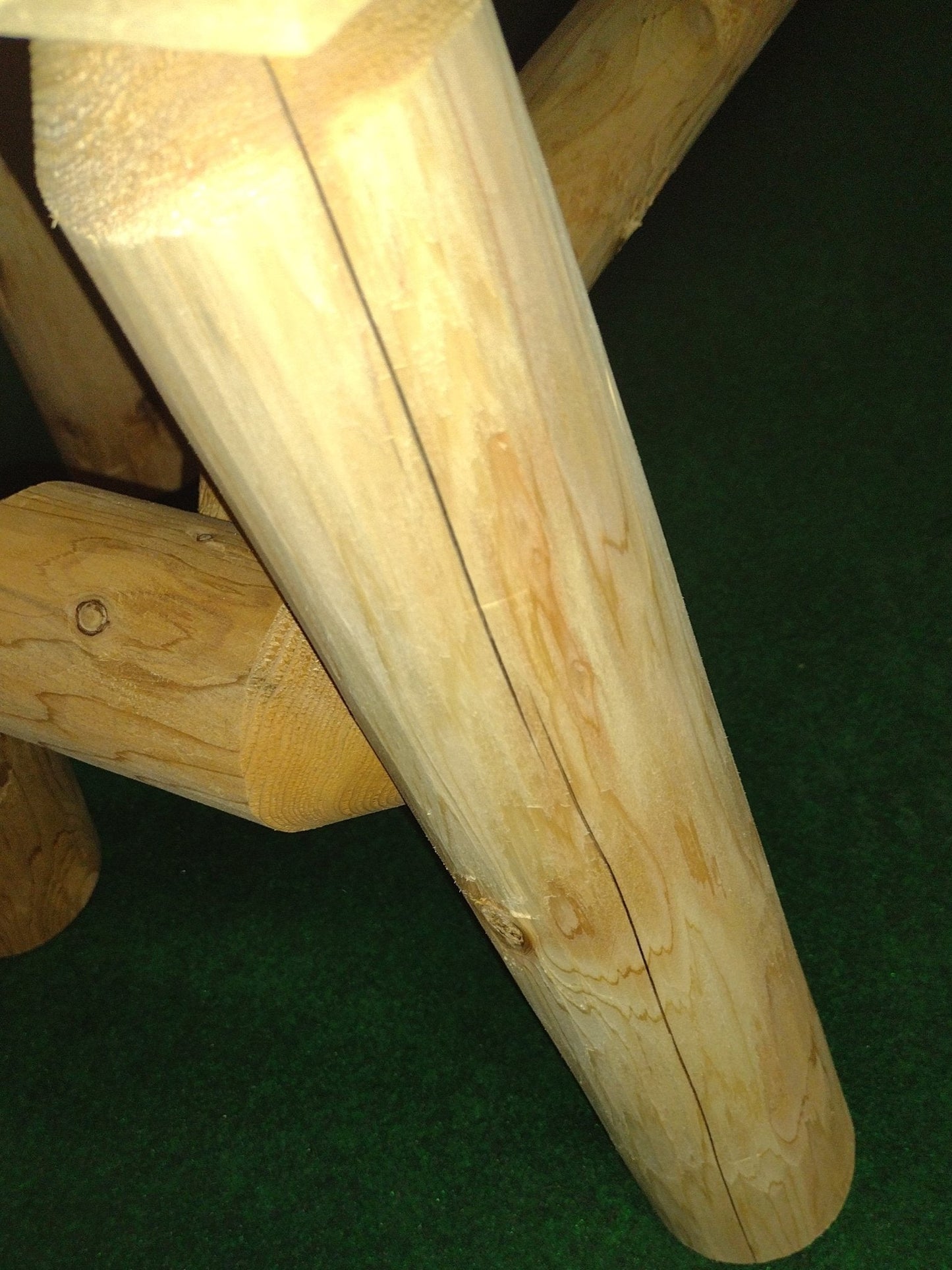 Cedar log table leg and bench support, light natural wood with visible knots