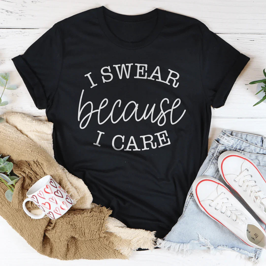 Black T-shirt with "I SWEAR because I CARE" graphic text, crew neck