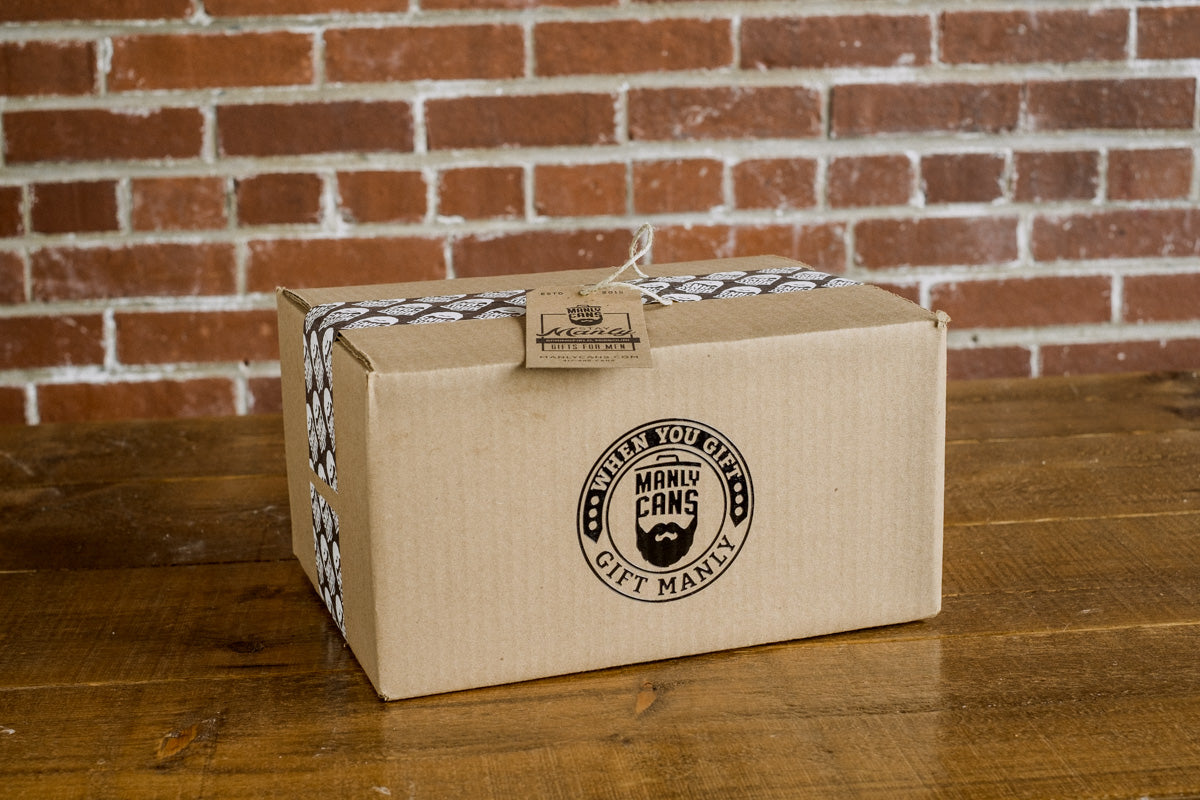 Cardboard gift box for BBQ seasoning gift set with round seal label on top.