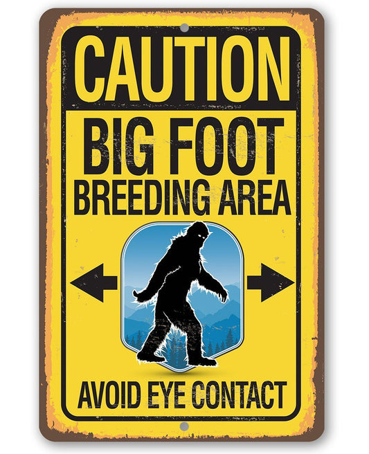 Metal caution sign with yellow border reading “CAUTION BIG FOOT BREEDING AREA”