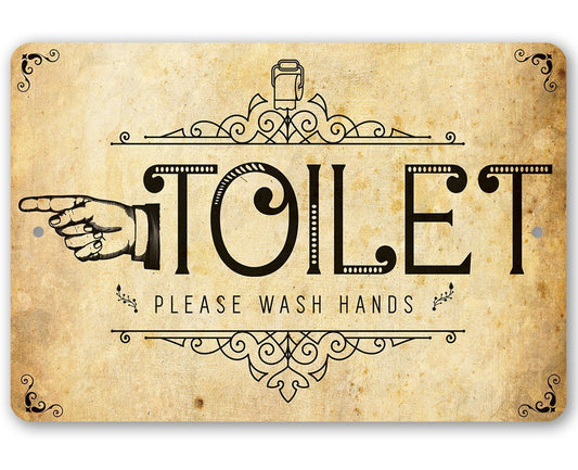 Decorative metal toilet direction sign with “TOILET” and “PLEASE WASH HANDS” in ornate frame