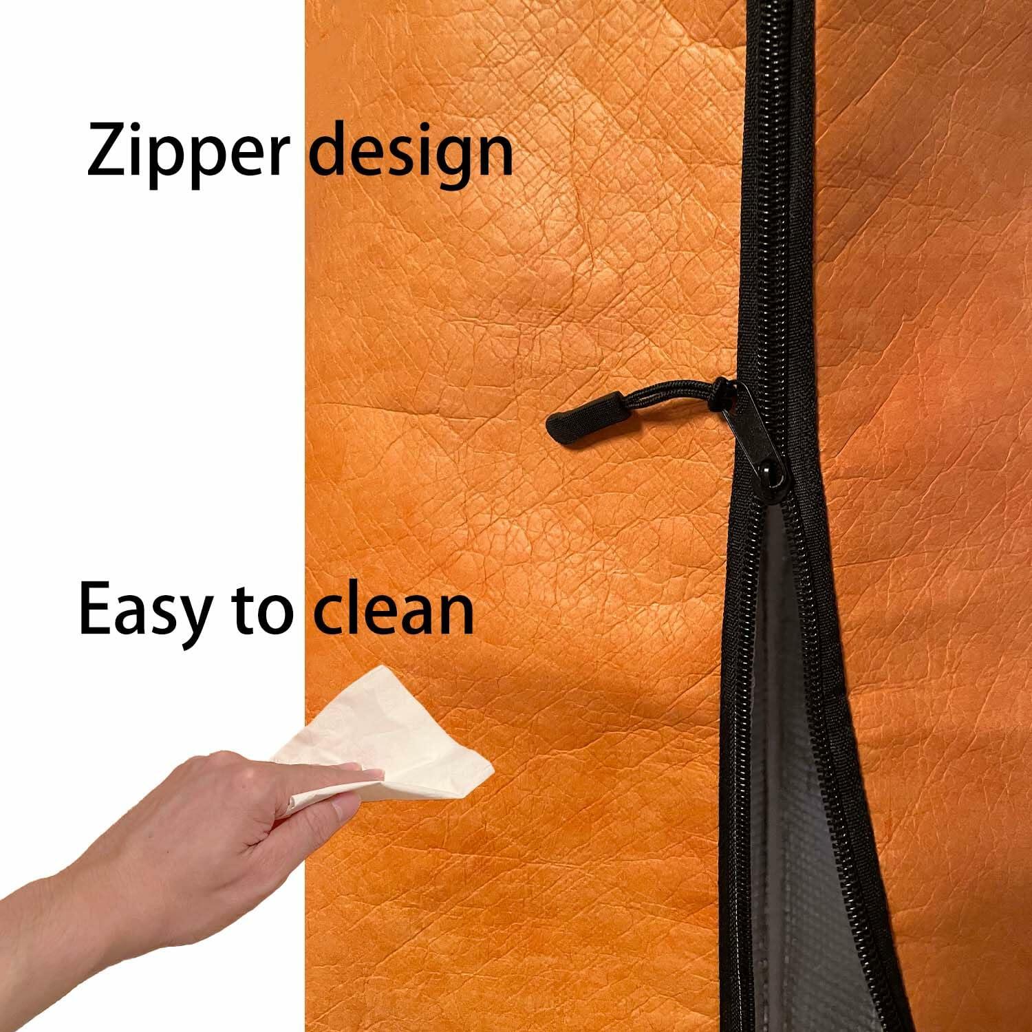 Orange BBQ blanket bag with black zipper and pull tab; textured insulated surface