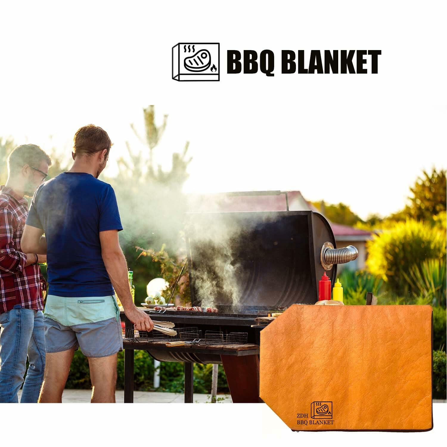 Orange BBQ blanket resting cover with logo, set near an outdoor grill