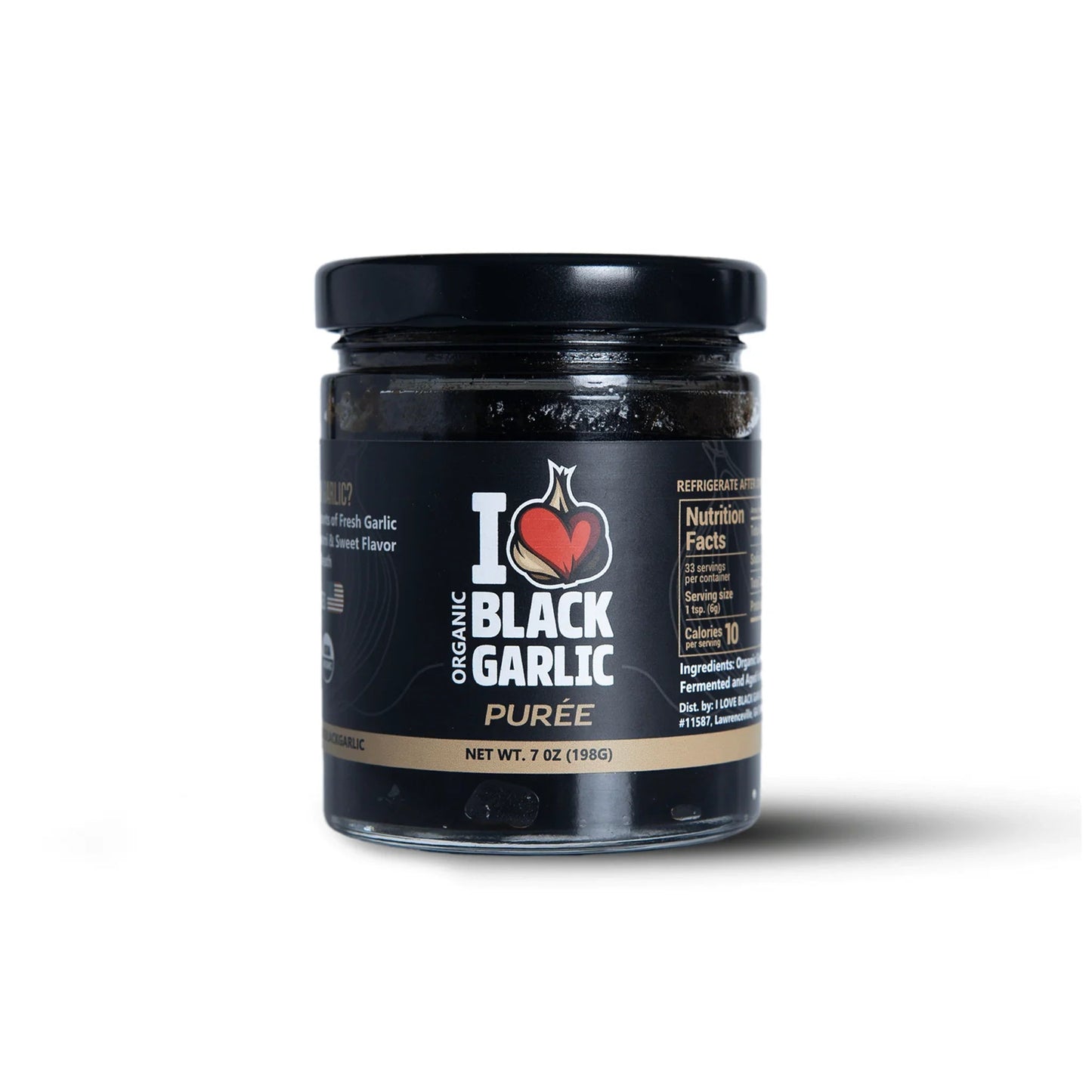 Black garlic purée in 7 oz glass jar with black lid, front label visible