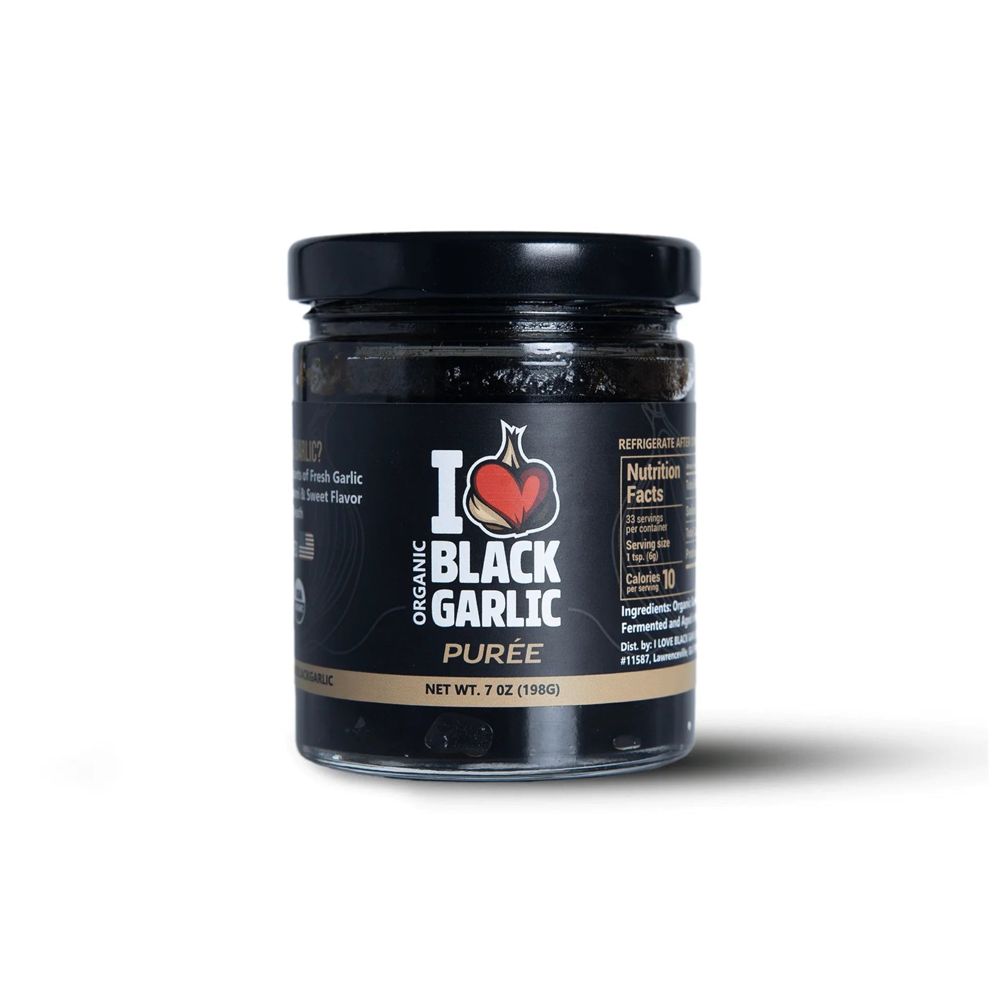 Black garlic purée in 7 oz glass jar with black lid, front label visible