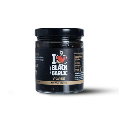 Black garlic purée in 7 oz glass jar with black lid, front label visible