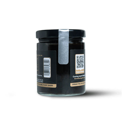 Black garlic purée jar side view with barcode and QR code on 7 oz glass