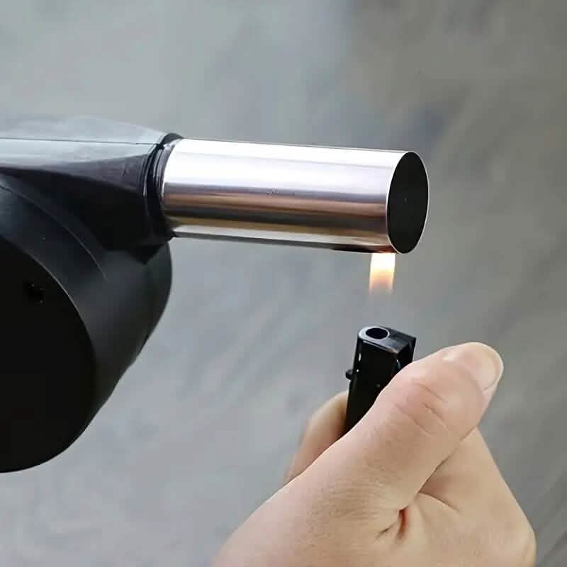 Hand-operated fire blower nozzle with silver tube and black fan housing