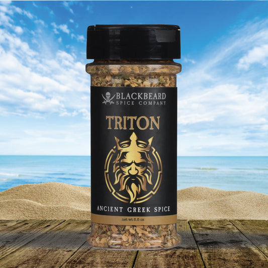 Triton Greek spice rub bottle with black cap and gold “TRITON” label