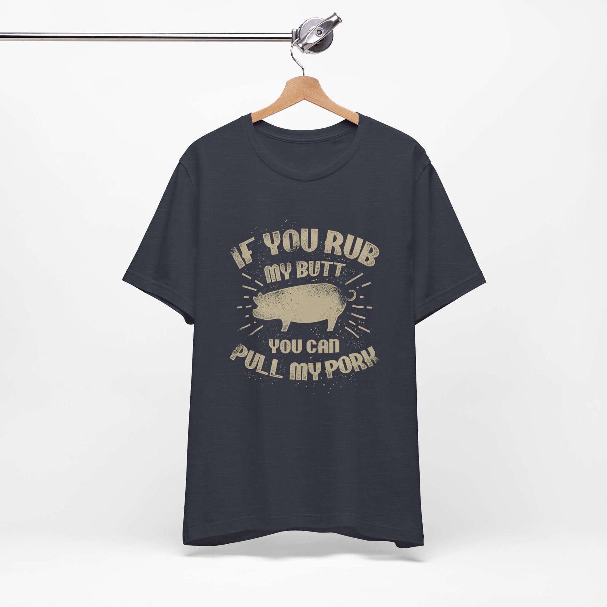 Navy BBQ T-shirt on hanger with centered pig graphic and quote-style lettering