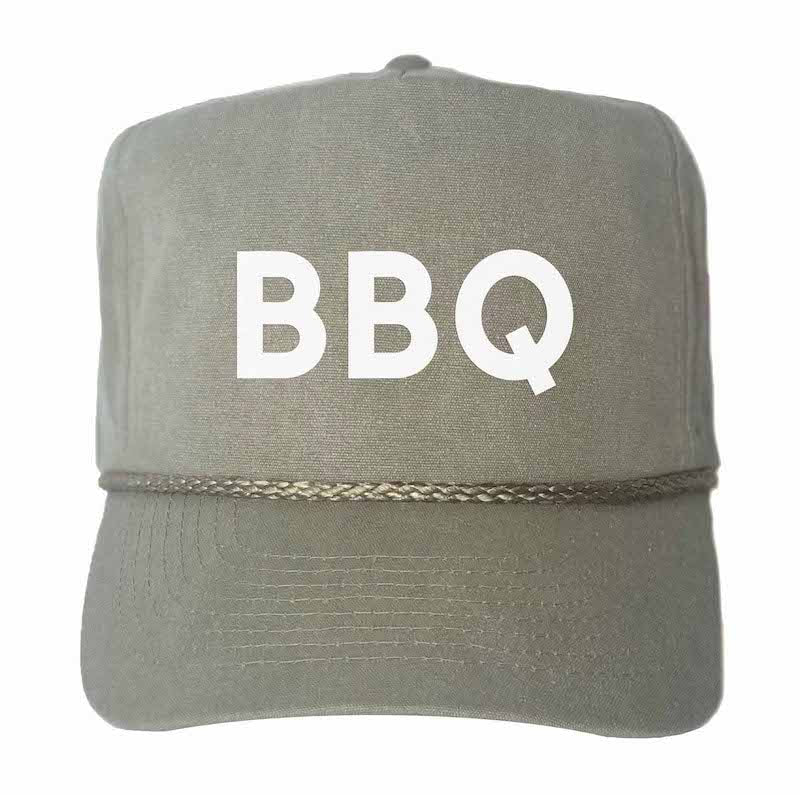 Stone-washed oat canvas trucker hat with white “BBQ” lettering on front