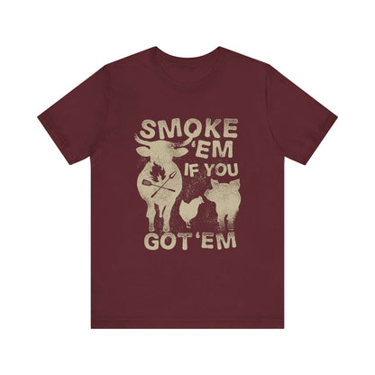 Maroon crew-neck t-shirt with distressed "SMOKE 'EM IF YOU GOT 'EM" front graphic