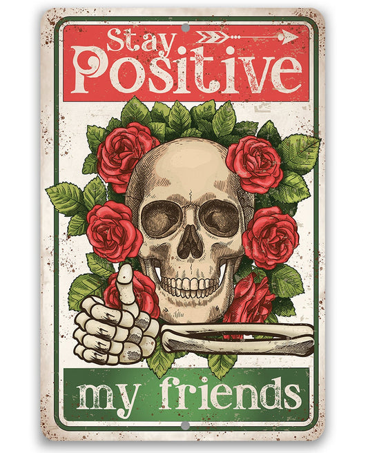 Stay Positive metal sign with skull, red roses, and “my friends” text