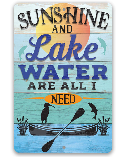 Metal sign: "Sunshine and Lake Water Are All I Need" with canoe graphic