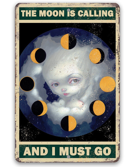 Moon-themed metal wall sign with woman face, yellow planets, 'THE MOON IS CALLING'
