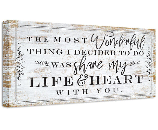 Canvas wall art with distressed border and quote text in black and script-style lettering