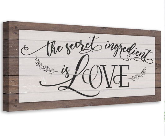Framed canvas wall art with cursive “The secret ingredient is LOVE” lettering