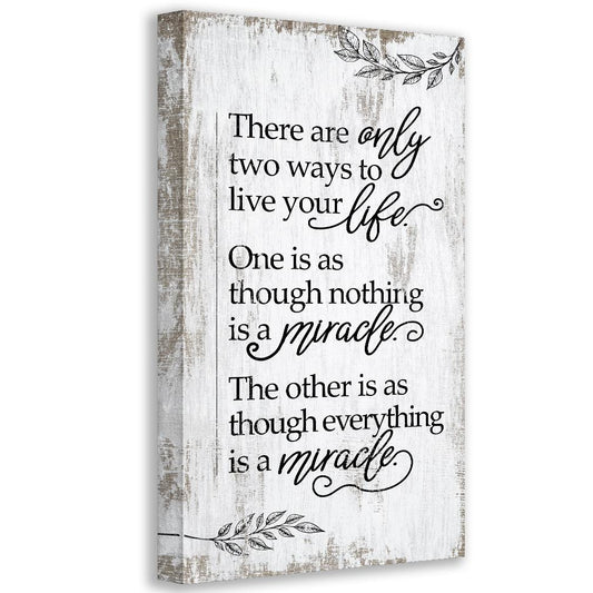 White canvas wall art with inspirational quote and botanical leaf accents, framed edges