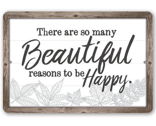 Rustic framed metal sign with black script 'Beautiful reasons to be Happy' and leaf line art
