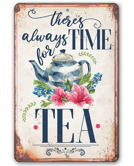 Metal tea-themed metal sign with floral teapot art and large TEA lettering.