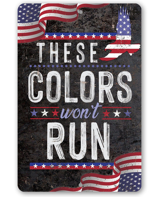 Patriotic metal sign with American flags and text “Colors won’t run”