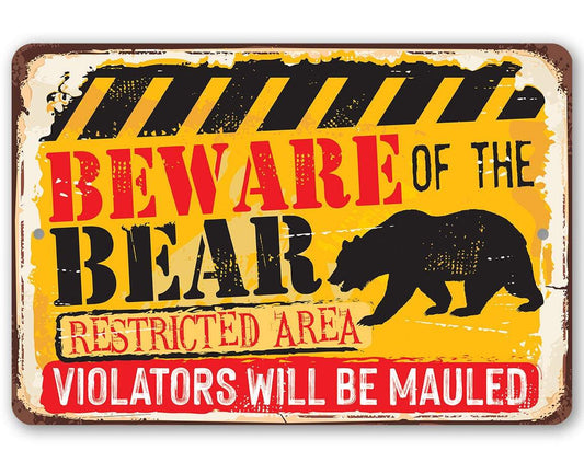 Metal bear warning sign with black bear silhouette and red "Beware" text