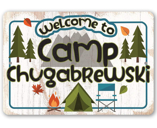 Camping welcome metal sign with Camp text, trees, chair, and fire icons