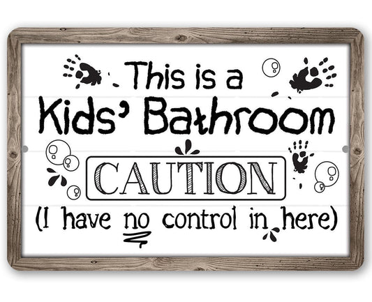 Framed metal sign reading “Kids’ Bathroom CAUTION” with paw prints.