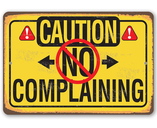 Yellow metal caution sign with bold CAUTION and no complaining text, red warning symbol