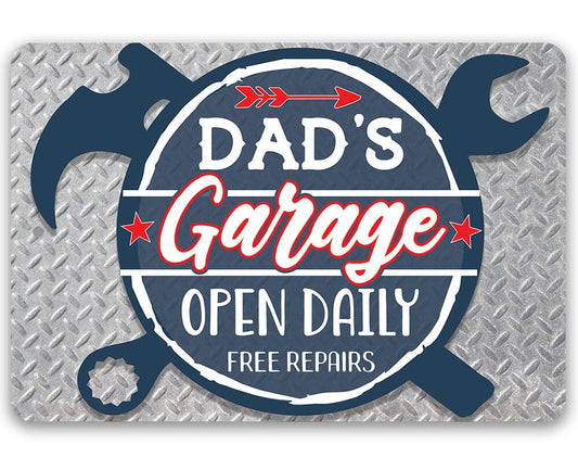 Aluminum garage sign with blue wrench border and red “Dad’s Garage” lettering